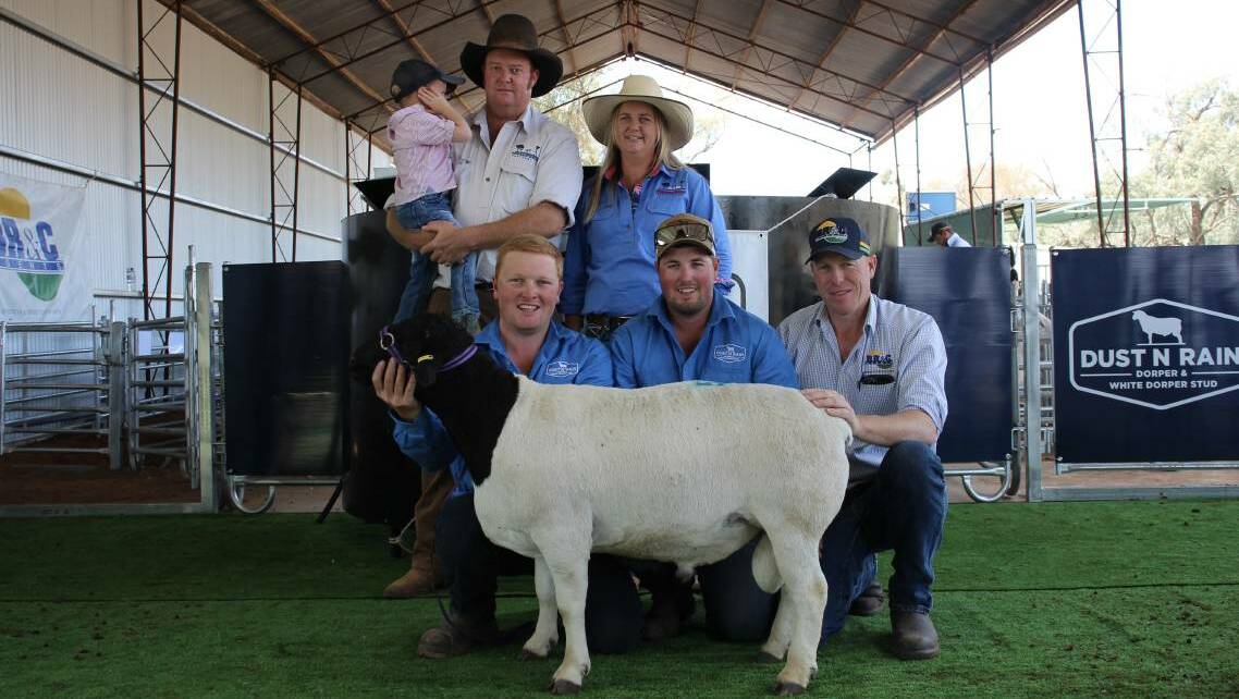 Buyers Dusty, Tom and Bec Palmer, with Dust'N Rain's Thomas and Jack Cullinan, and BR&C agent Darren Old and the top-priced $8600 Dorper ram. Picture: Alexandra Bernard