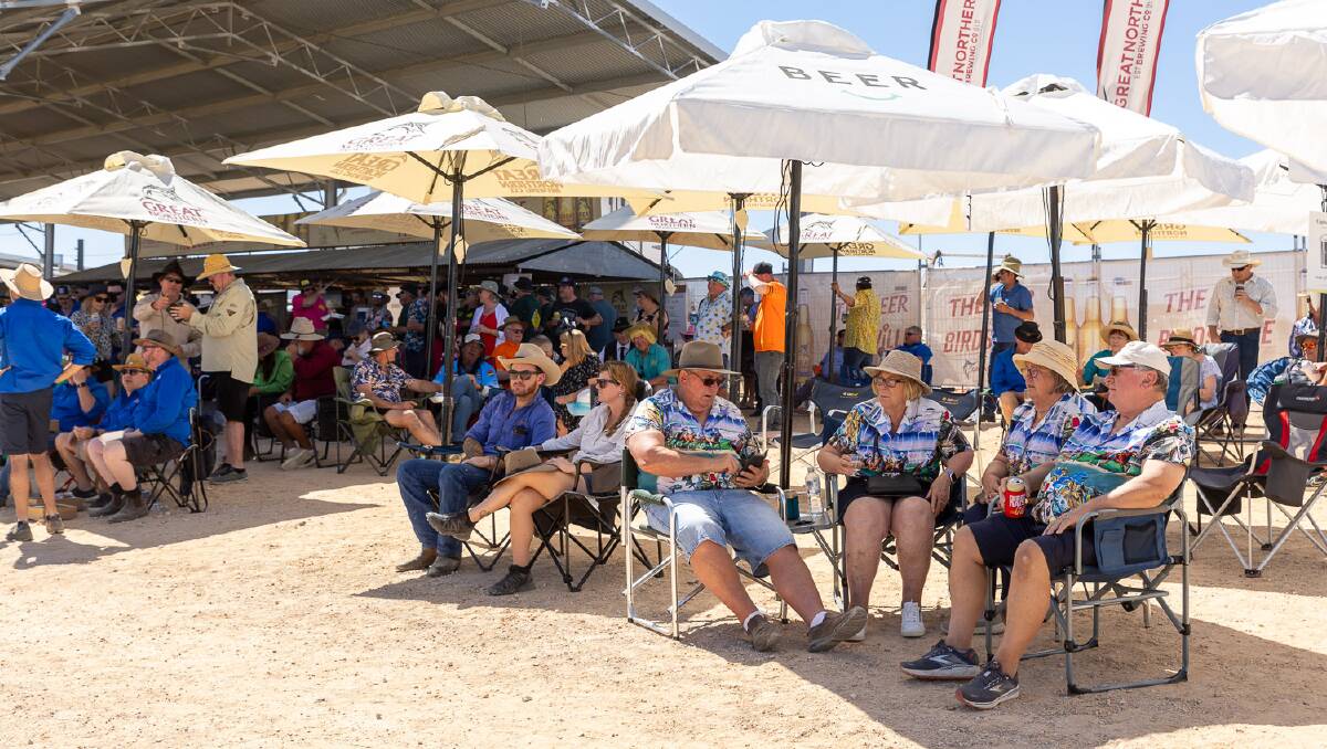 Punters cool off at the 2023 Birdsville Races. Picture by Matt Williams