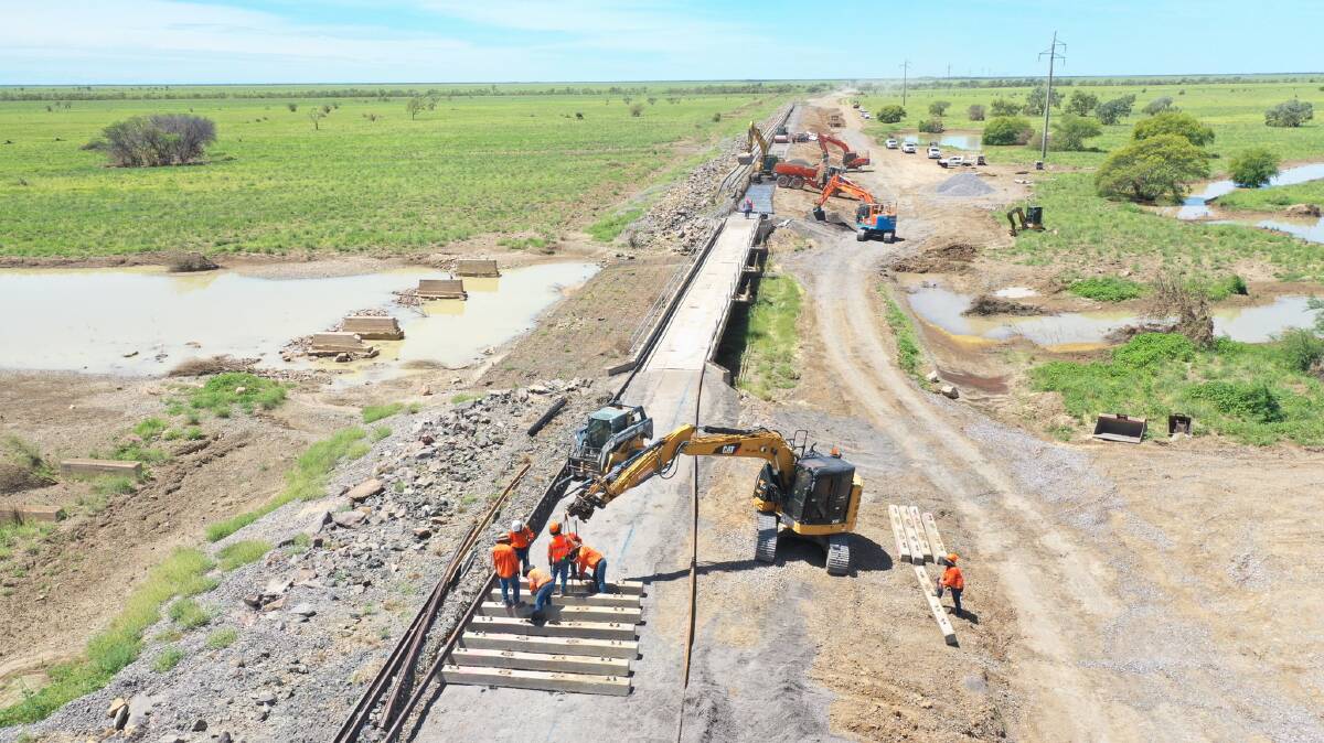 Queensland Rail crews work to restore the damaged Mount Isa rail line in 2019. Picture QR