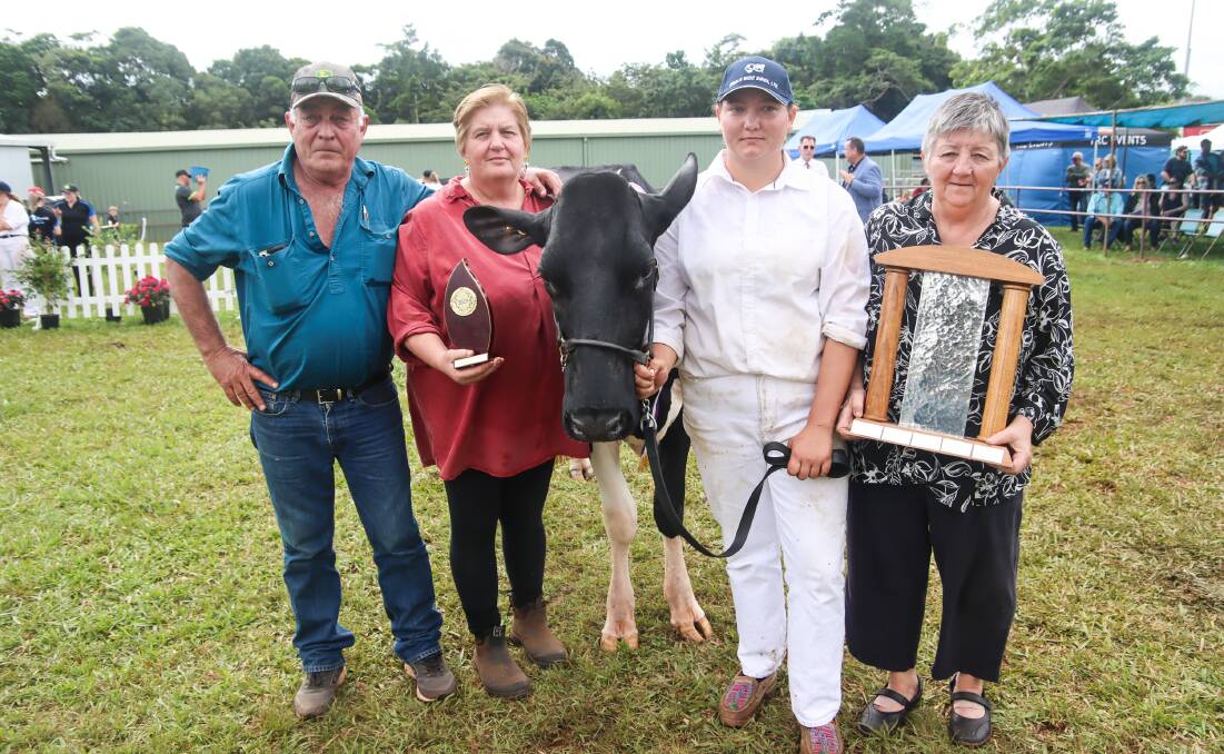 The Michael Daley Memorial Trophy won by Millaa View Tattoo Calamity. Pictured are Michael's siblings David Daley (who owns the cow), Bronwyn English, Terese Daley (niece) and Anne Daley. Photo by Lea Coghlan.