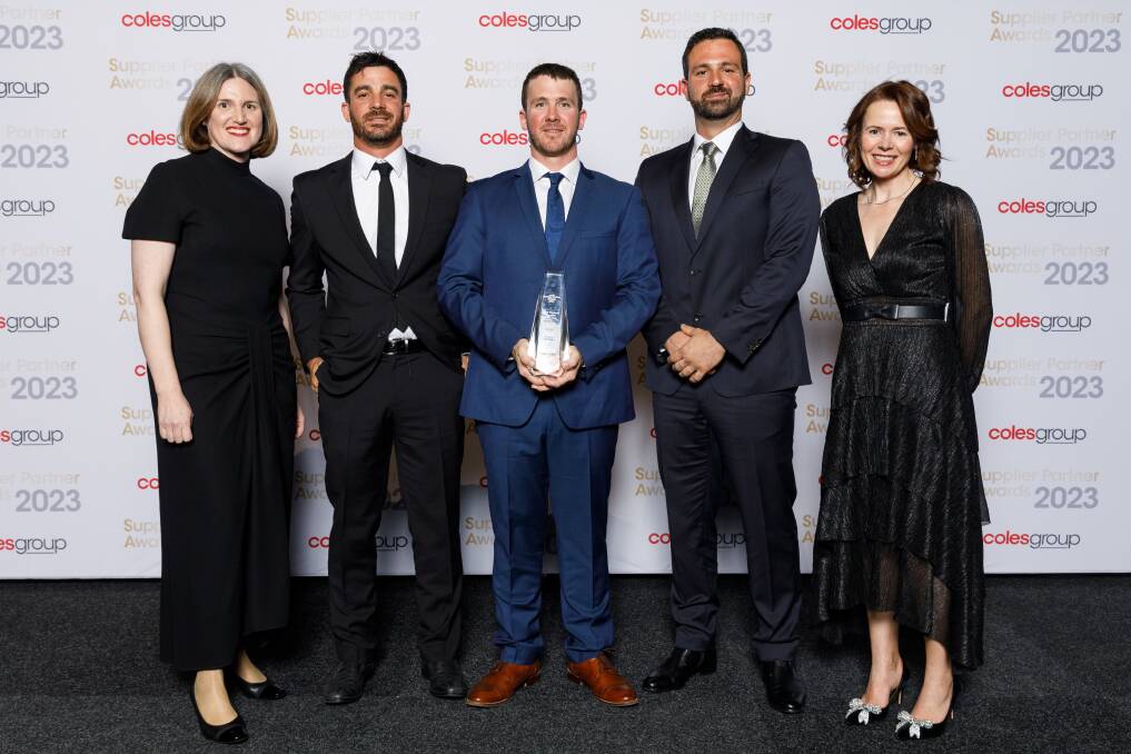 Coles Group chief executive officer Leah Weckert, left, congratulates the Pirrone Brothers, Ayr, for being named Coles Fresh Produce Supplier of the Year. Photo supplied