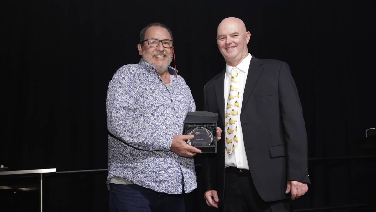 Richard Piper, entomologist, Department of Agriculture and Fisheries, was recognised for his work in the banana industry. He is pictured here with ABGC chair Leon Collins. Picture supplied