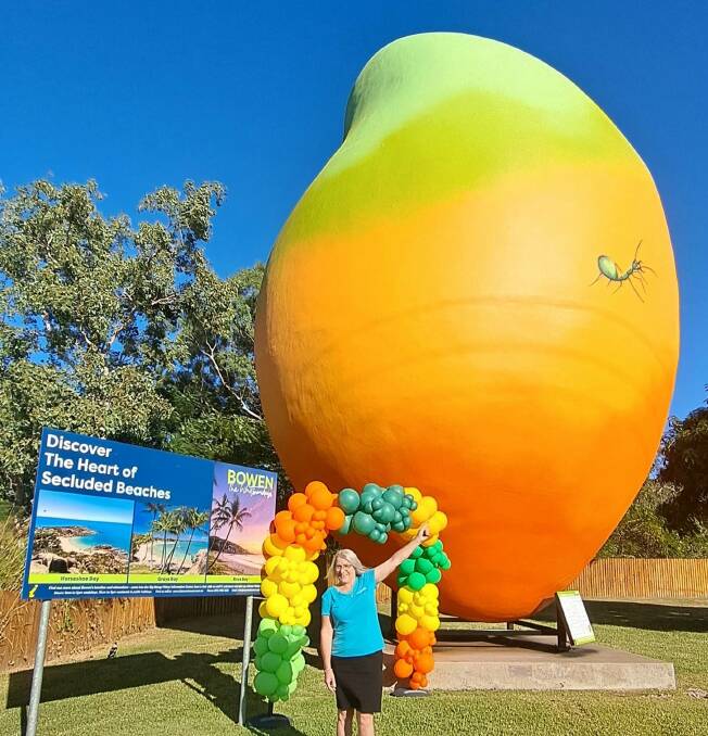Bowen Tourism & Business manager Leanne Abernethy in front of the Big Mango. Picture supplied by Bowen Tourism & Business