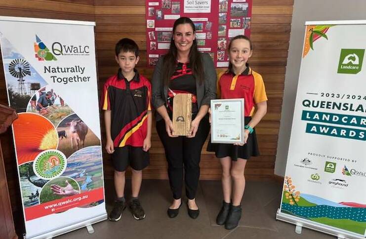 Solomon Davidson, teaching principal Eleanor McKay and Amber Barnes with their Landcare Award. Picture: Supplied
