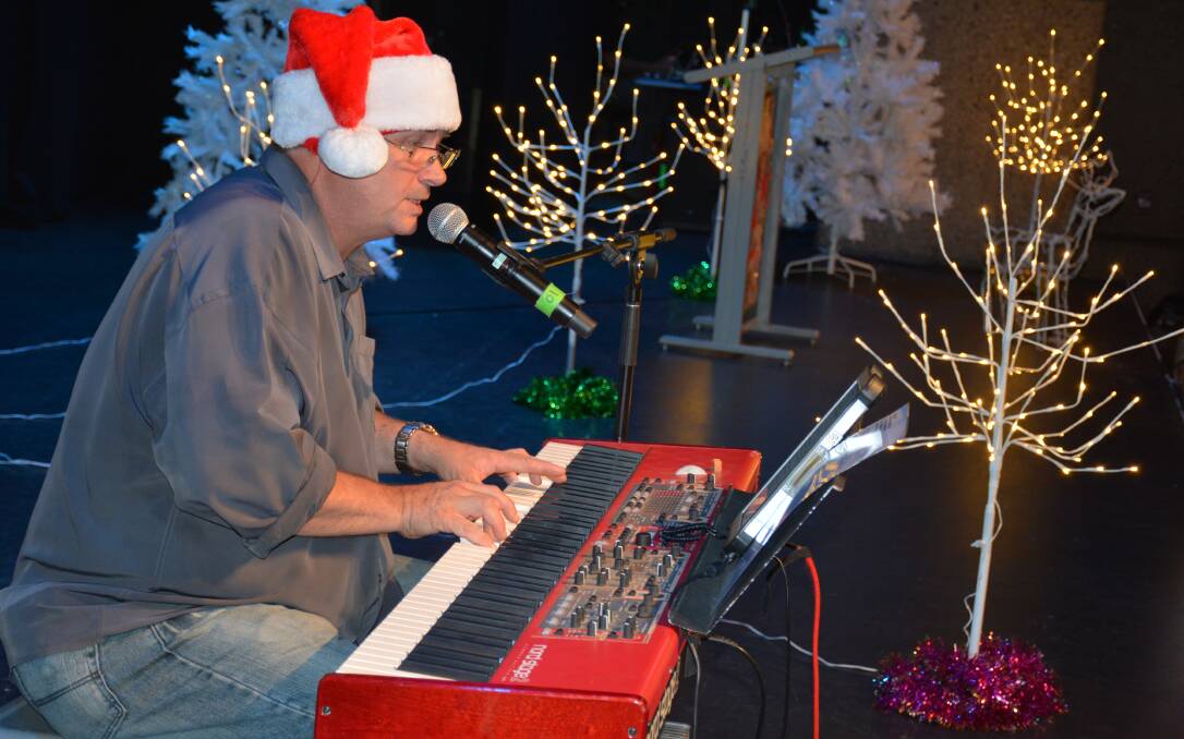 SETTING THE FESTIVE SPIRIT: David Whitehead performs for the Mount Isa City Council's Christmas seniors' luncheon. 