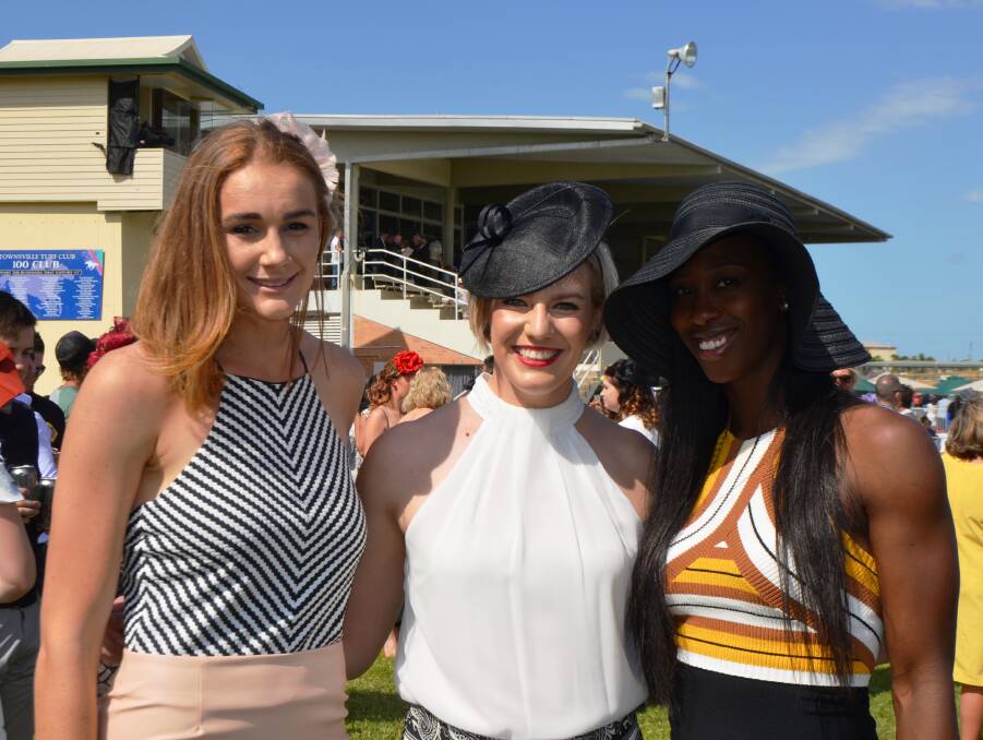 Darcee Garvan, Perth; Mia Murray, Townsville and Tamara Tatham, Toronto, Canada are all style and smiles while checking out the action track side at Cluden.