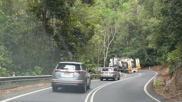 An oversize truck without a pilot travelling on the section of road in question, moving onto the wrong side of the road and with its trailer starting to cut into the corner. Picture supplied.