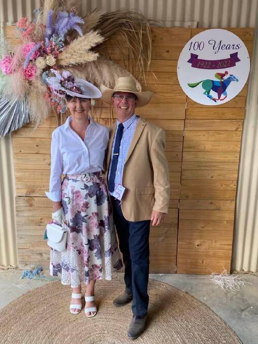 Committee member David Rawnsley, right, with partner Debbie Beggs, Townsville, raising the fashion stakes at the 2022 centenary meet. Picture: Supplied