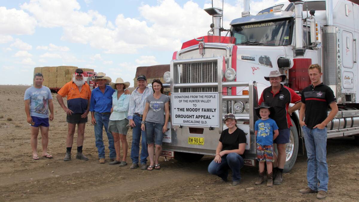 True mateship: Together with Anthony and Sue Moody (third and fourth left) at the end of the long journey to deliver $30,000 worth of hay were Anthony Bonar, Greg Ernst, Graham Crow, Robyn Crow, Ashley Ernst, Fletcher Knodler, Brian Knodler, and Brian Fuller.