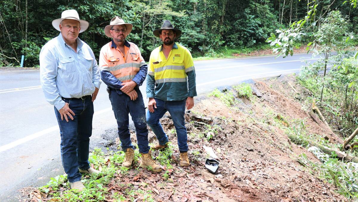 Hill MP Shane Knuth, Dempsey Cranes and Construction owner Chris Dempsey, and Ravenshoe Chamber of Commerce vice president Blake Kidner inspecting the site where a truck rolled down an embankment on the Kennedy Highway in February 2023. Picture supplied.