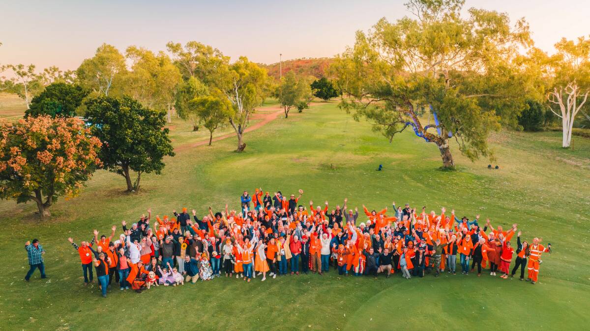 Outback Golf Masters participants waving from the Mount Isa golf course at the conclusion of the 2023 event. Picture supplied.