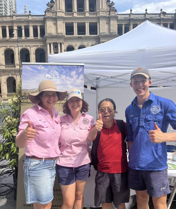 Kay, Georgia, and Harry Tommerup, and a very enthusiastic taste tester in the Brisbane CBD on National Ag Day. Picture supplied