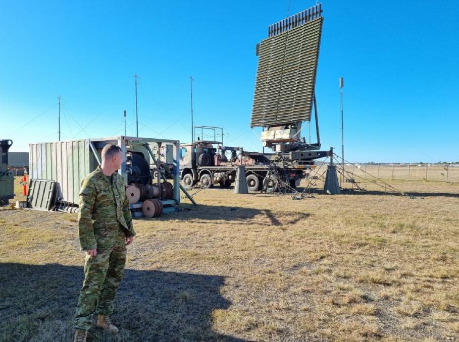 Network Technician Leading Aircraftman Brodie Groen from No. 114 Mobile Control and Reporting Unit, observes the system status of the AN-TPS-77 radar, at Evans Head Memorial Airfield, New South Wales, during Exercise Talisman Sabre 2021.