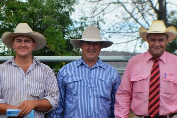 Matt and Ken Muller, KM Cattle Company Pty Ltd, Biloela, topped the North Queensland Droughtmaster Bull Sale with Fletchervale Pastoral Company paying $6000 for KM Nowhere 170 (P). They are pictured here with Elders Stud Stock Auctioneer Randall Spann.