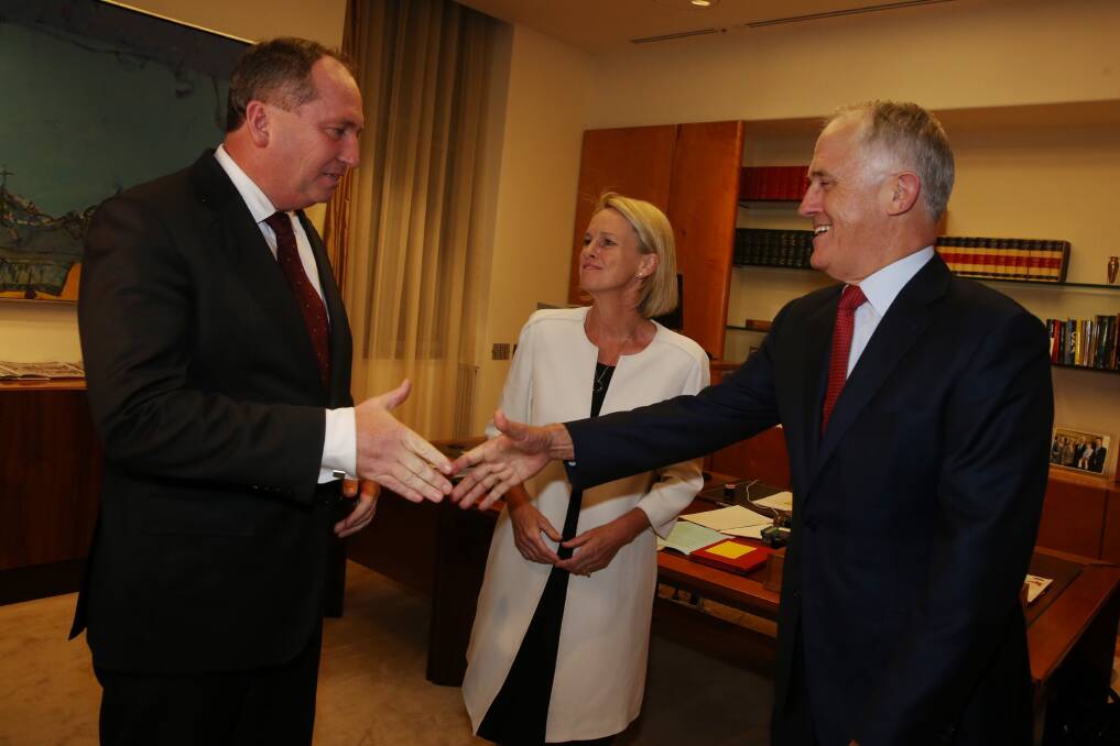 Barnaby Joyce (left) and Fiona Nash greet Liberal Prime Minister Malcolm Turnbull after last week's change of National Party leadership.