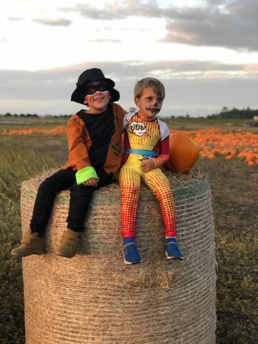 Bowen kids Knite Land, 4, and Raffy Pilcher, get into the spirit of Halloween at Stackelroth Farms, Delta, who are the nation's largest growers of Halloween pumpkins. Picture - Luana Land.