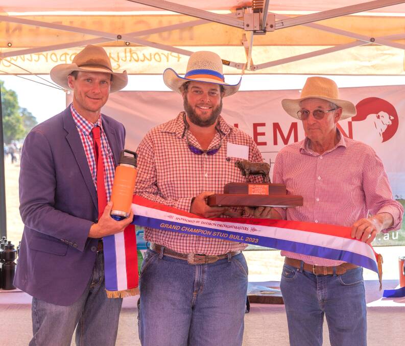 Judge John Atkinson and Ninian Stewart-Moore present winner Luke Carrington of Rondel Droughtmasters with the grand champion stud bull prizes. Pictures: Zoe Thomas Photography 