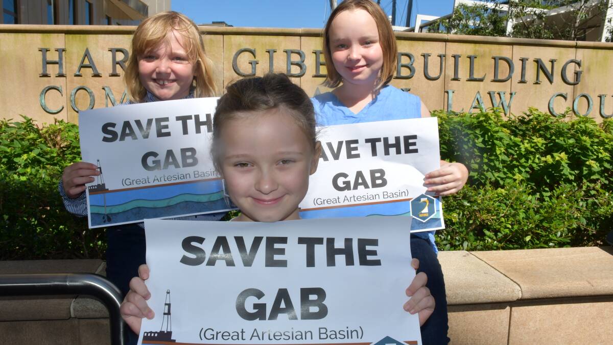 Claire and Cate Kennedy, 9, from Dirranbandi with (front) Lola Andreasson, 6, of Brisbane, show their support for the GAB at AgForce's court case earlier this year. Picture: Alison Paterson